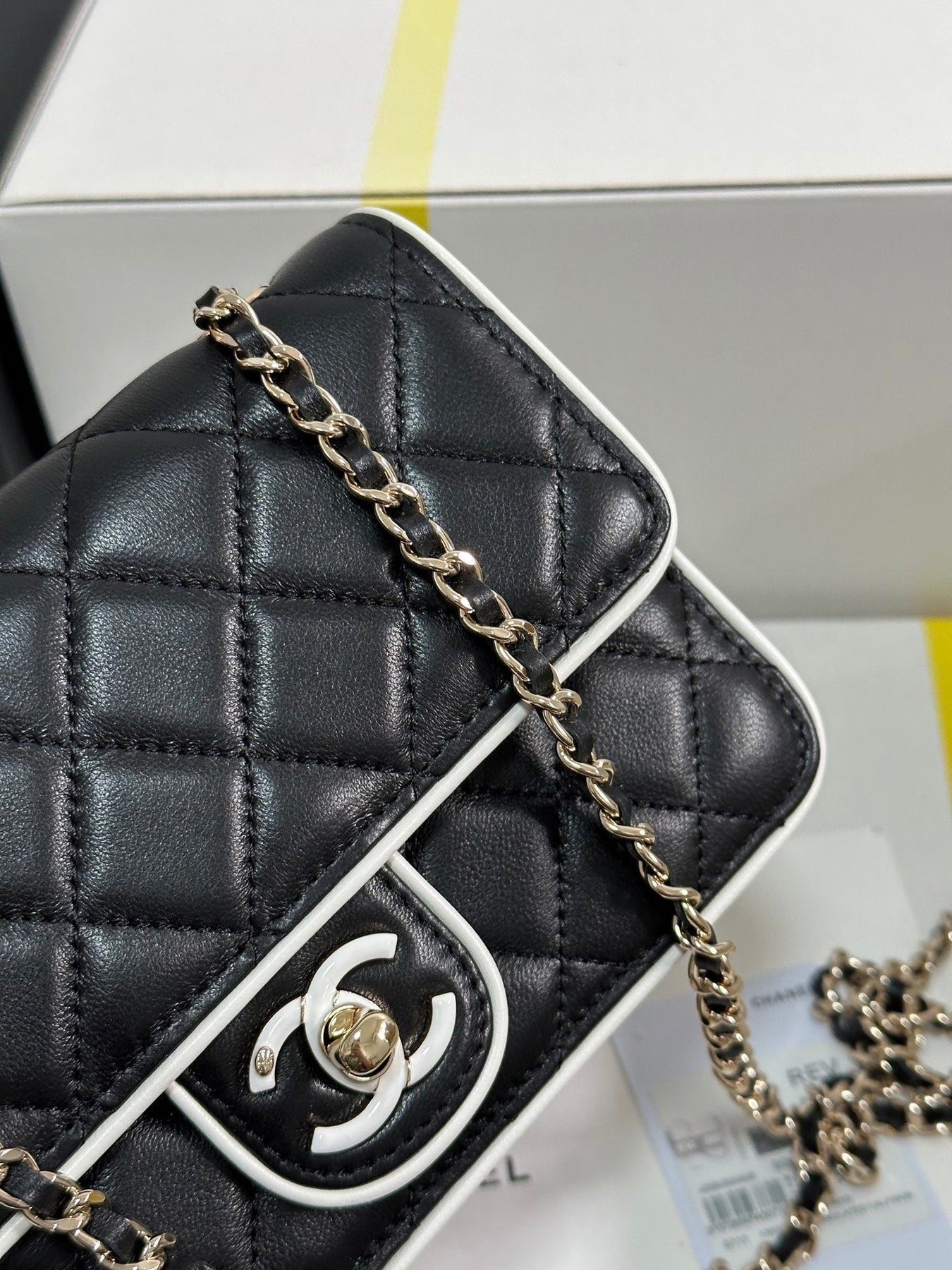 QUILTED FLAP BAG WITH WHITE TRIM 19 IN BLACK LAMBSKIN