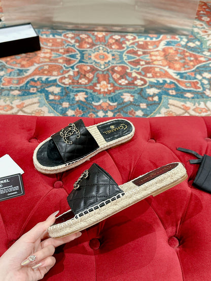 FLAT SLIPPERS IN BLACK LAMBSKIN AND WOVEN WITH LOGO