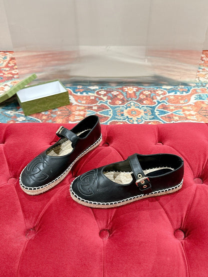 GG CROSS STRAP FLAT SHOES IN BLACK CALFSKIN WITH STRAW SOLE