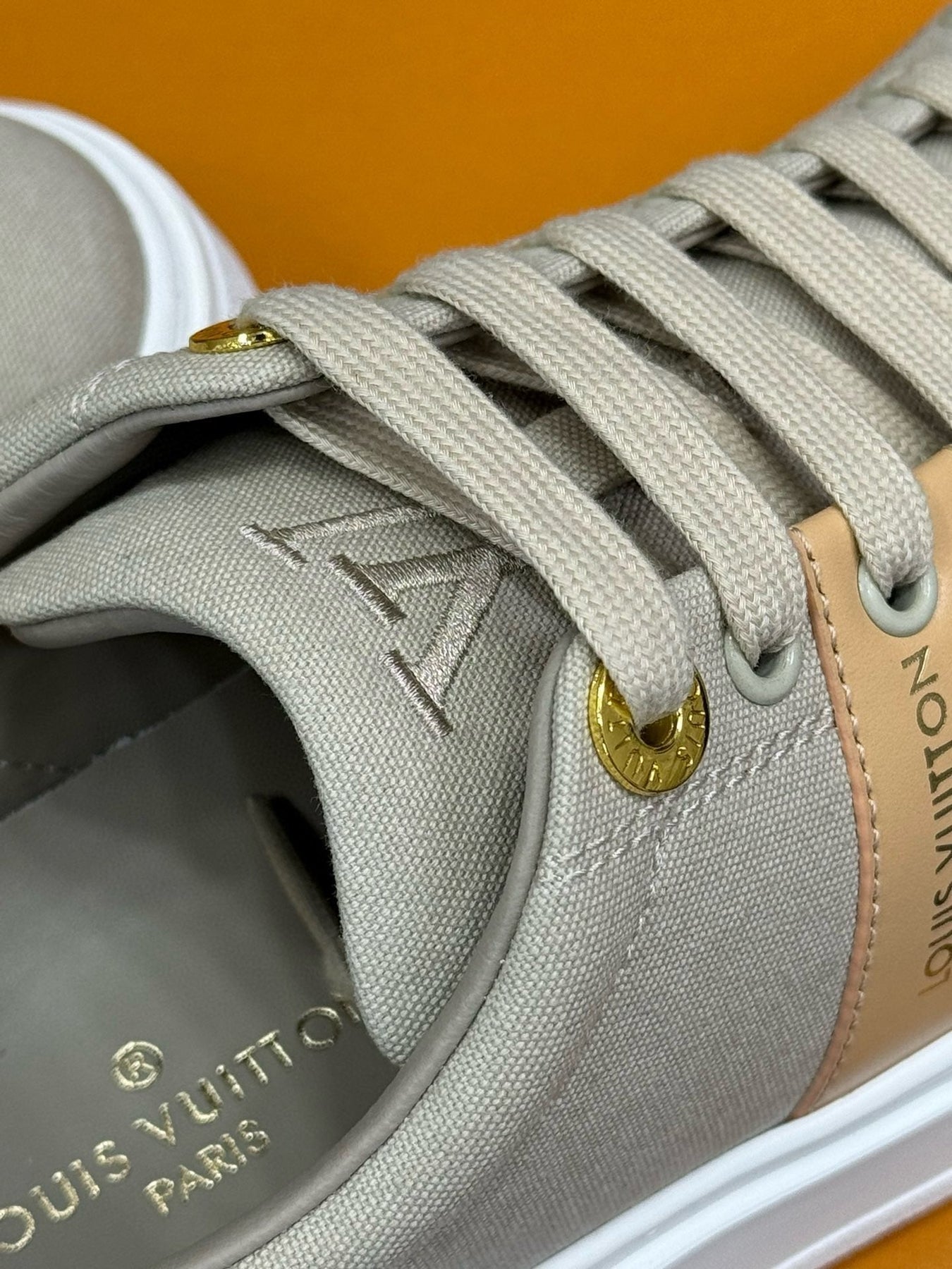 LV TIME OUT SNEAKER IN PASTEL GRAY MIX MACAROON GOLD CANVAS
