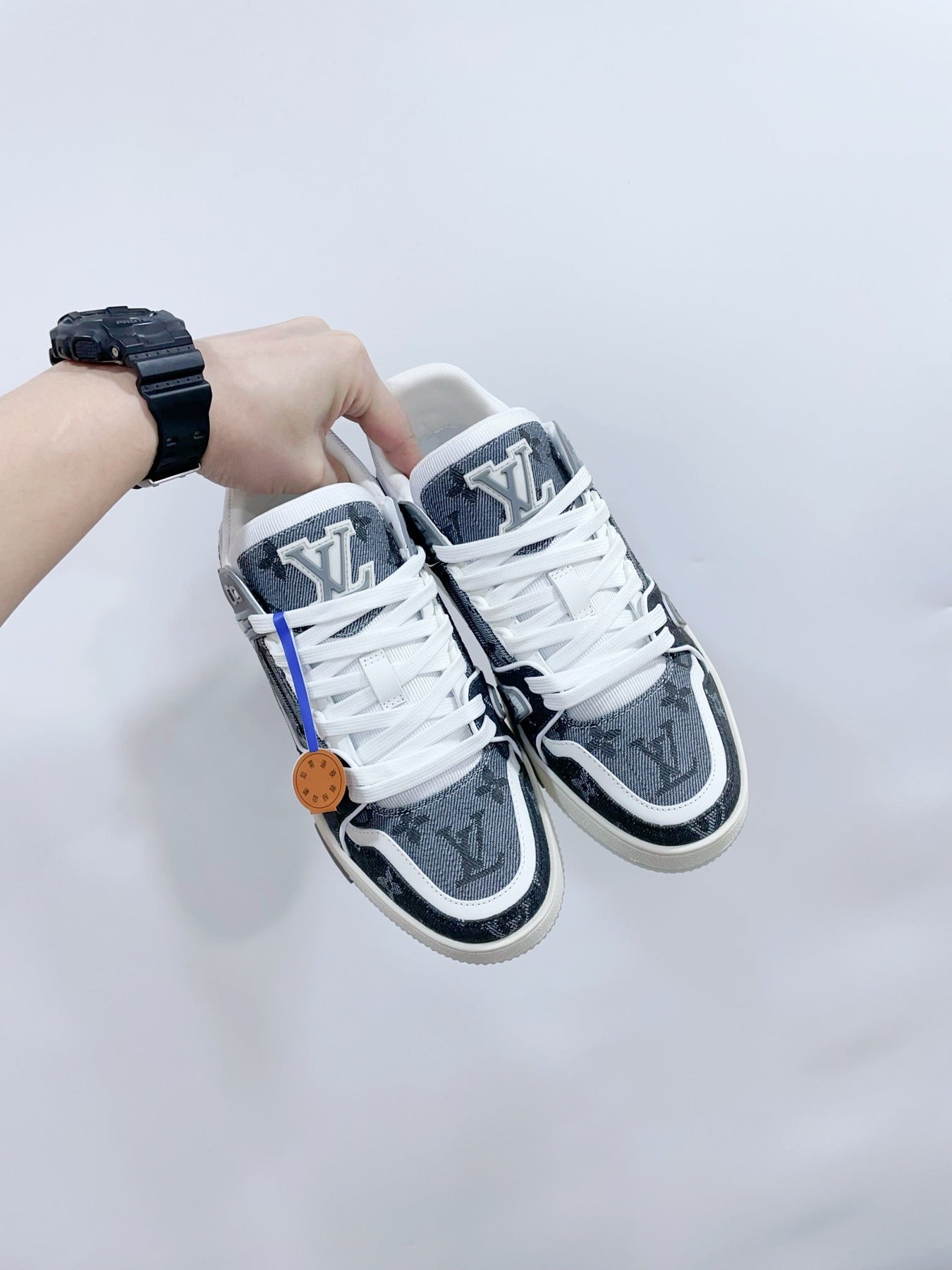 LV TRAINER SNEAKER IN DOVE GRAY MONOGRAM DENIM