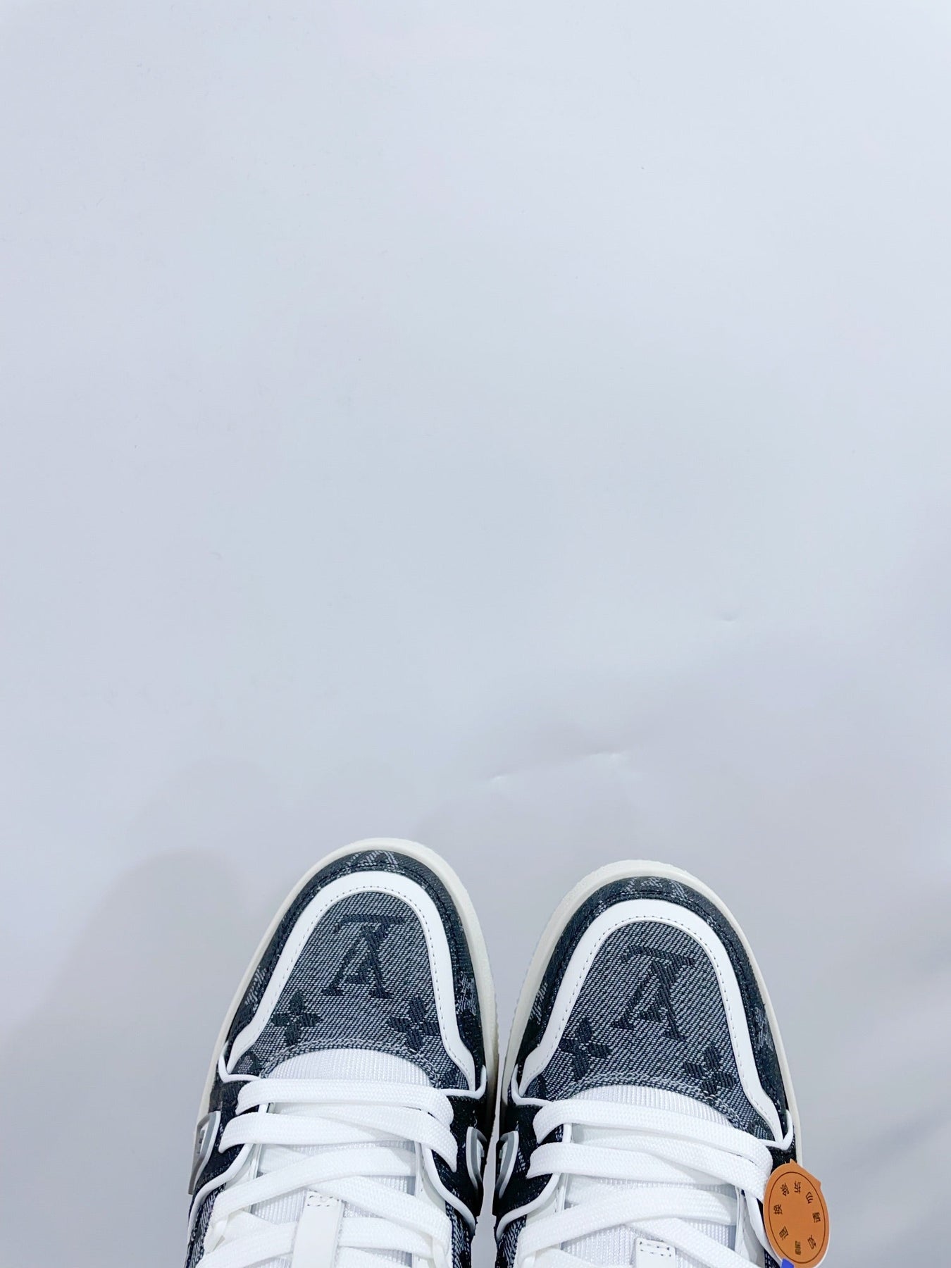 LV TRAINER SNEAKER IN DOVE GRAY MONOGRAM DENIM