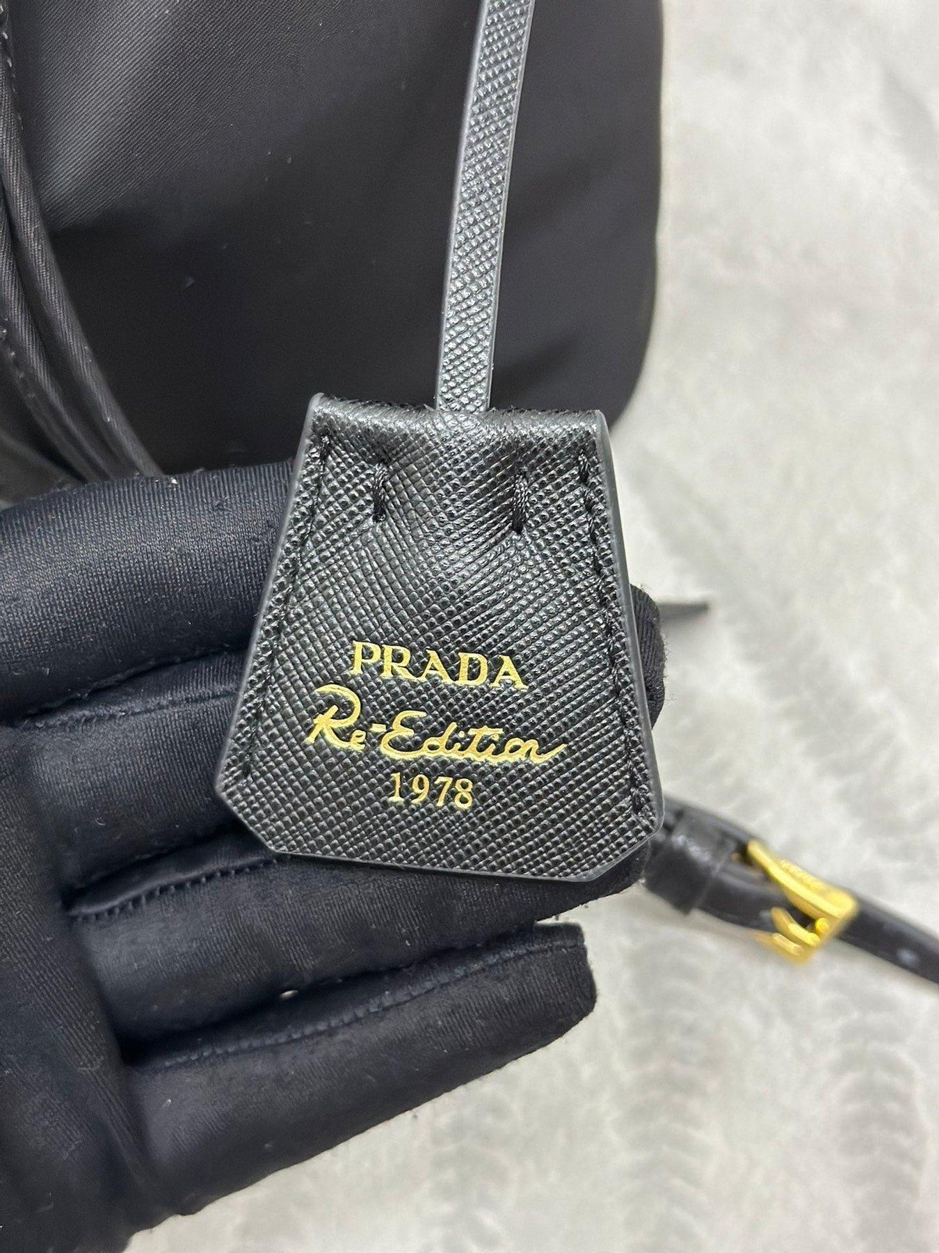 BUCKET BAG 19 IN BLACK RE-NYLON AND CALFSKIN HANDLE