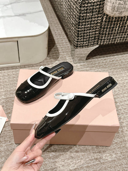 FLAT MULE IN BLACK AND WHITE PATENT CALFSKIN