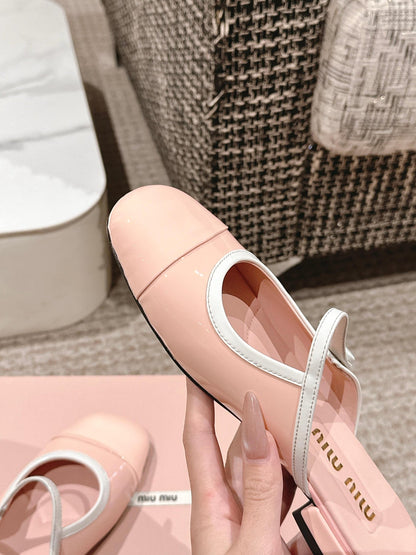 FLAT MULE IN PALE PINK PATENT CALFSKIN