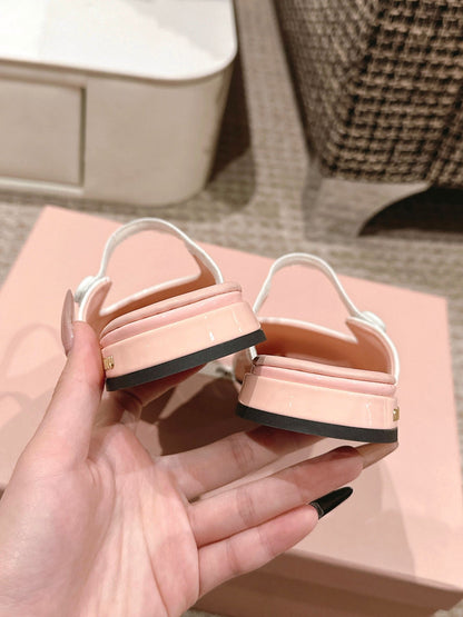 FLAT MULE IN PALE PINK PATENT CALFSKIN