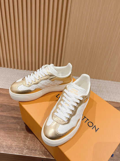 LV TRAINER SNEAKER IN GOLD MIX WHITE EMBOSSED CALFSKIN