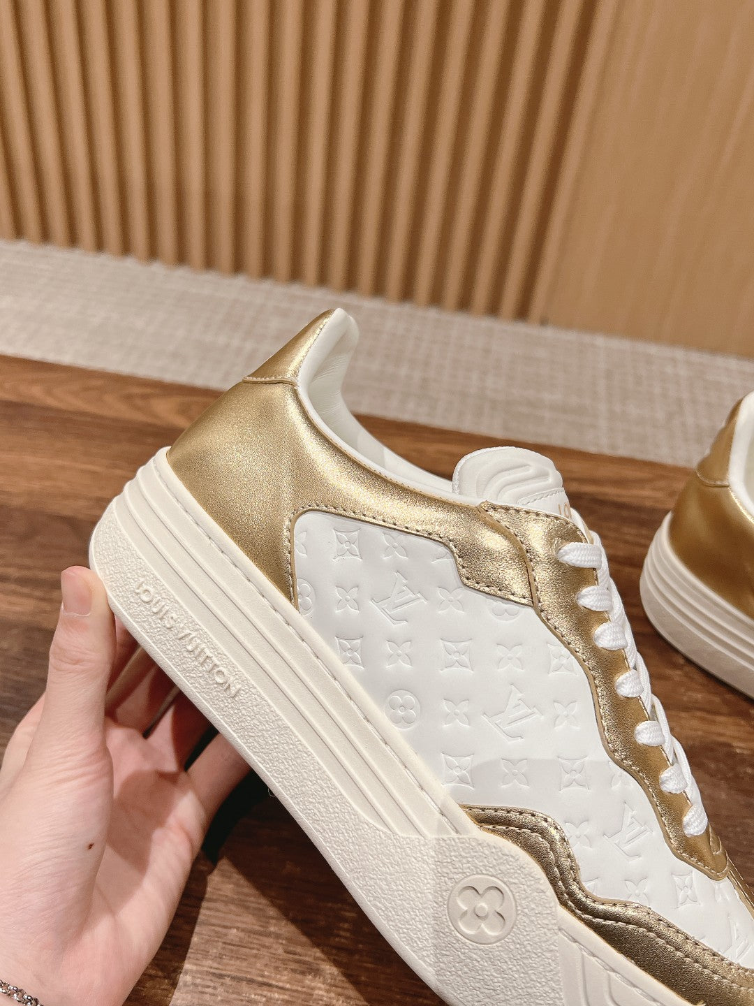 LV TRAINER SNEAKER IN GOLD MIX WHITE EMBOSSED CALFSKIN
