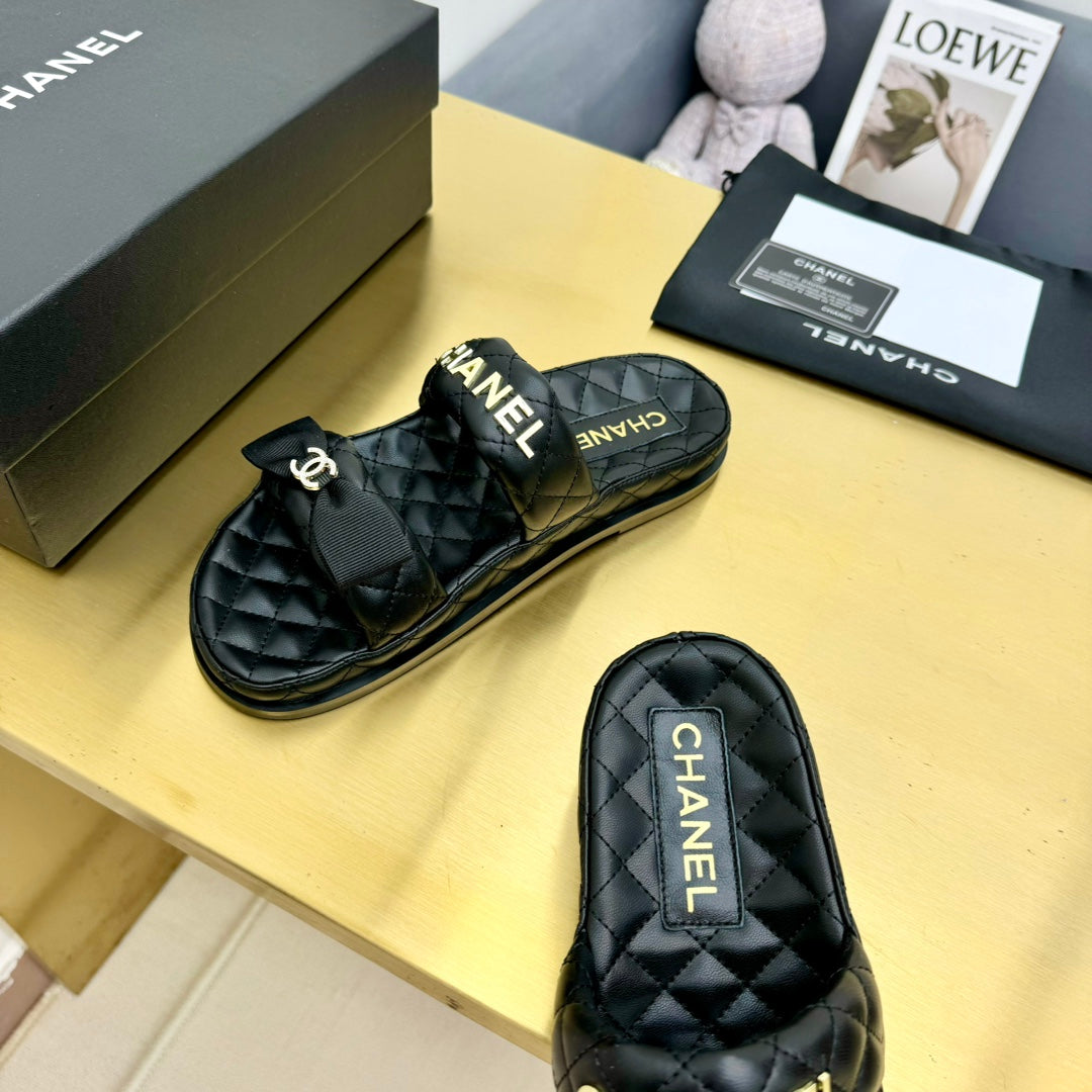 DAD SANDALS WITH BOW IN BLACK LAMBSKIN MULE