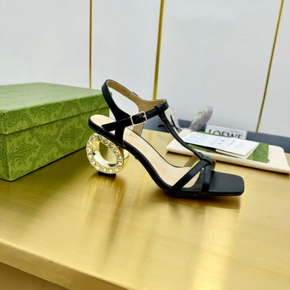 MEDIUM-HEEL SANDAL IN BLACK CALFSKIN GOLD HARDWARE WITH RHINSTONES