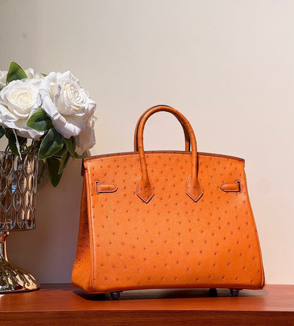 KELLY SELLIER 25 BAG IN FIRE ORANGE OSTRICH LEATHER WITH SILVER HARDWARE