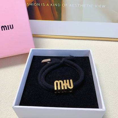 BLACK SCRUNCHIE SPANDEX FABRIC GOLD LOGO 167002