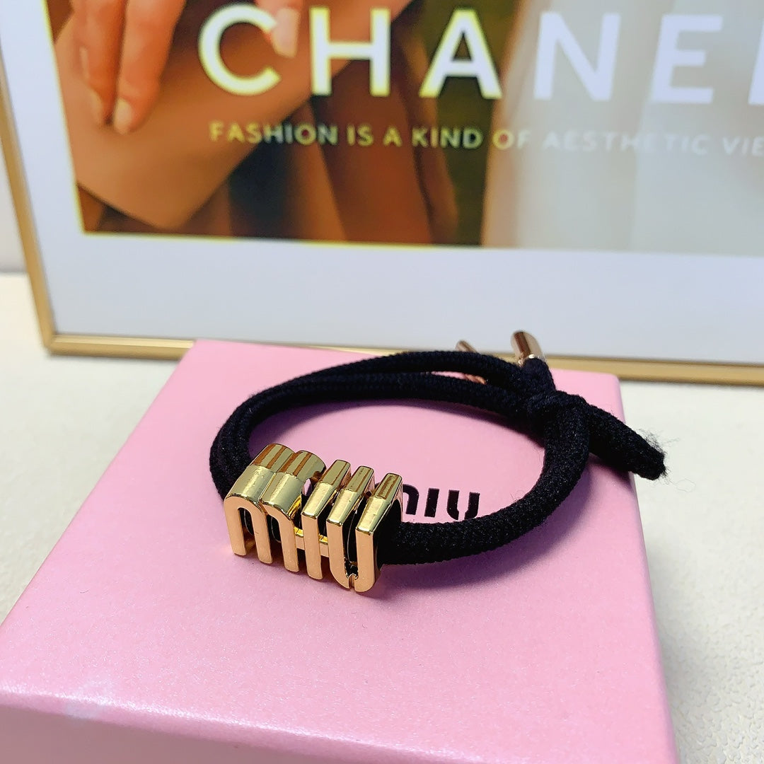 BLACK SCRUNCHIE SPANDEX FABRIC GOLD LOGO 167002