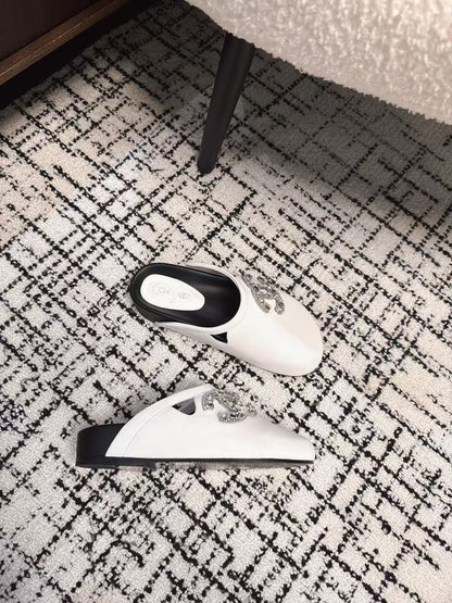 FLAT MULES IN WHITE CALFSKIN