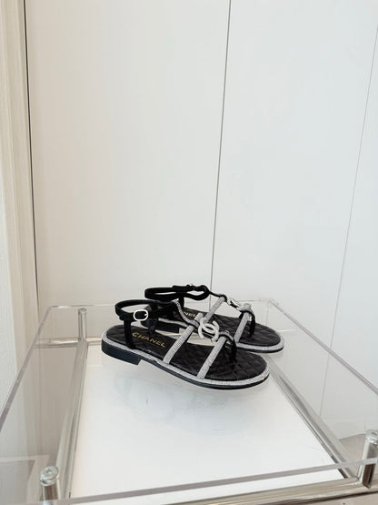 FLAT SANDALS IN BLACK SOFT LEATHER WITH SILVER STONE