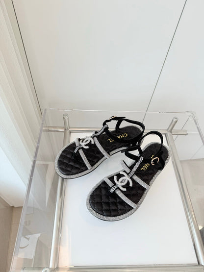 FLAT SANDALS IN BLACK SOFT LEATHER WITH SILVER STONE