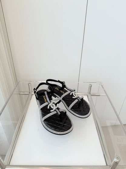 FLAT SANDALS IN BLACK SOFT LEATHER WITH SILVER STONE
