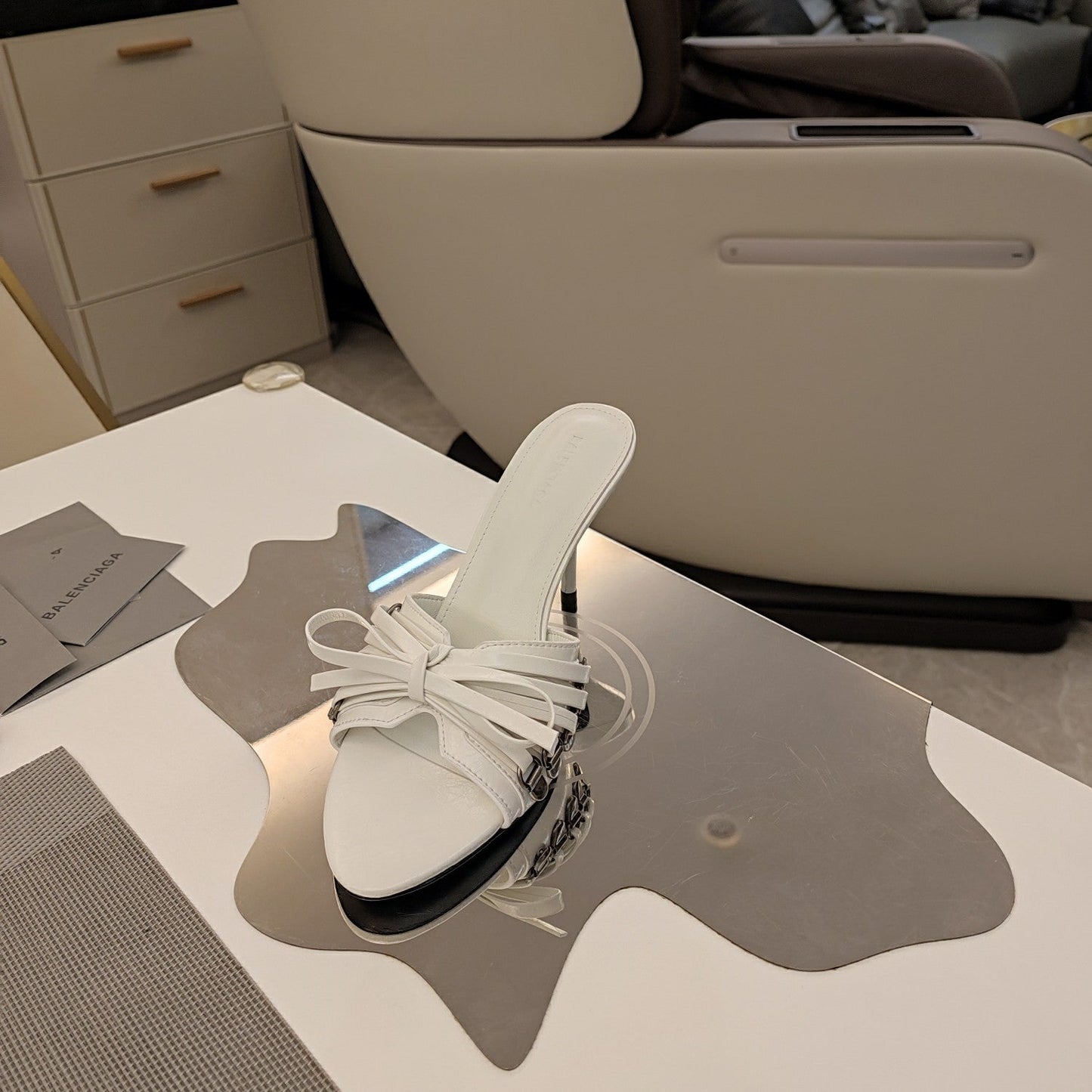 BOW-EMBELLISHED HIGH MULES IN WHITE SHEEPSKIN