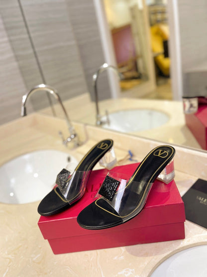 HIGH MULE 60MM IN BLACK SHEEPSKIN AND TRANSPARENT PVC