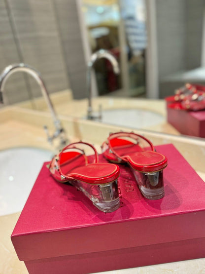 ROCKSTUD MULE SANDALS IN CHERRY RED CALFSKIN AND TRANSPARENT PVC FILM