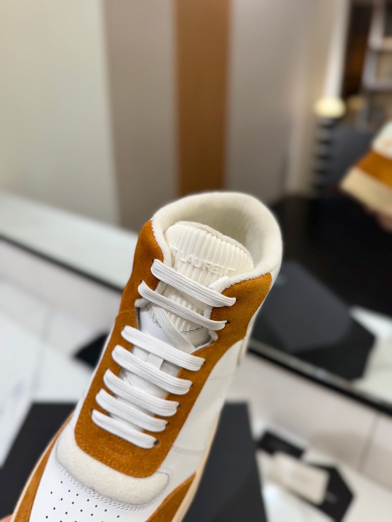 MID-TOP SNEAKERS IN WHITE PERFORATED LAMBSKIN AND BRONZE ORANGE SUEDE
