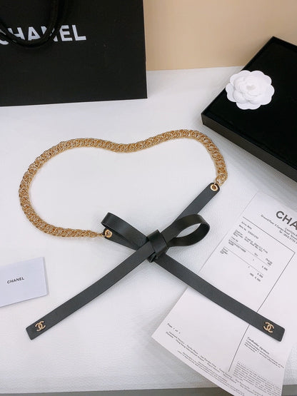 RIBBED BOW WAIST CHAIN IN GOLD TONE BRASS AND BLACK LAMBSKIN