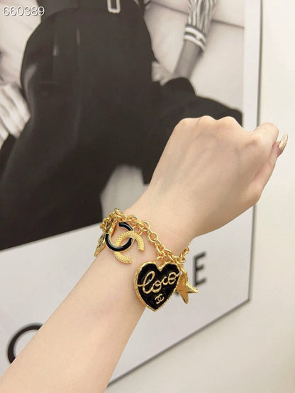 CC BRACELET IN GOLD PLATING CHAIN WITH MULTI CHARM