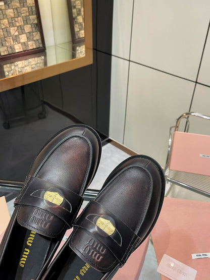 PENNY LOAFERS IN BLACK WITH A RED UNDERTONE CALFSKIN