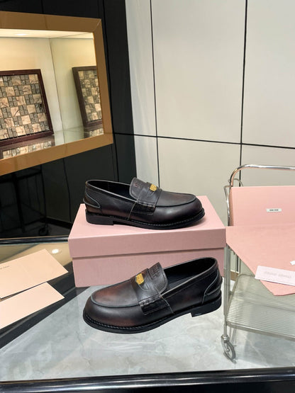 PENNY LOAFERS IN BLACK WITH A RED UNDERTONE CALFSKIN