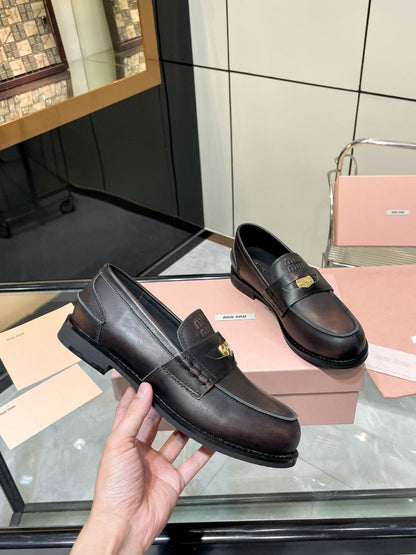 PENNY LOAFERS IN BLACK WITH A RED UNDERTONE CALFSKIN